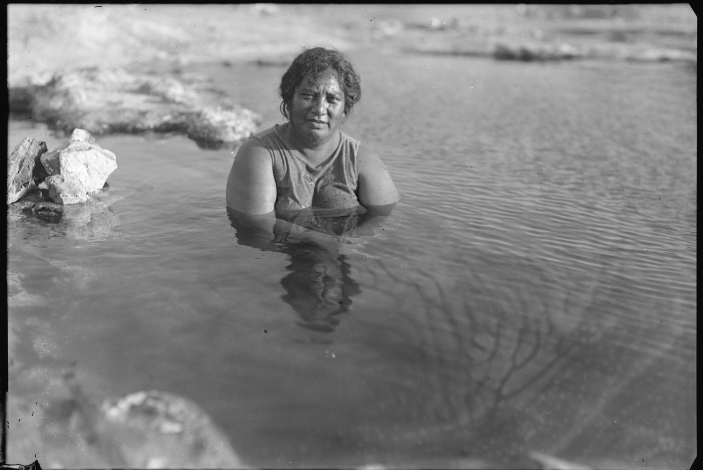 Maori woman in hot pool