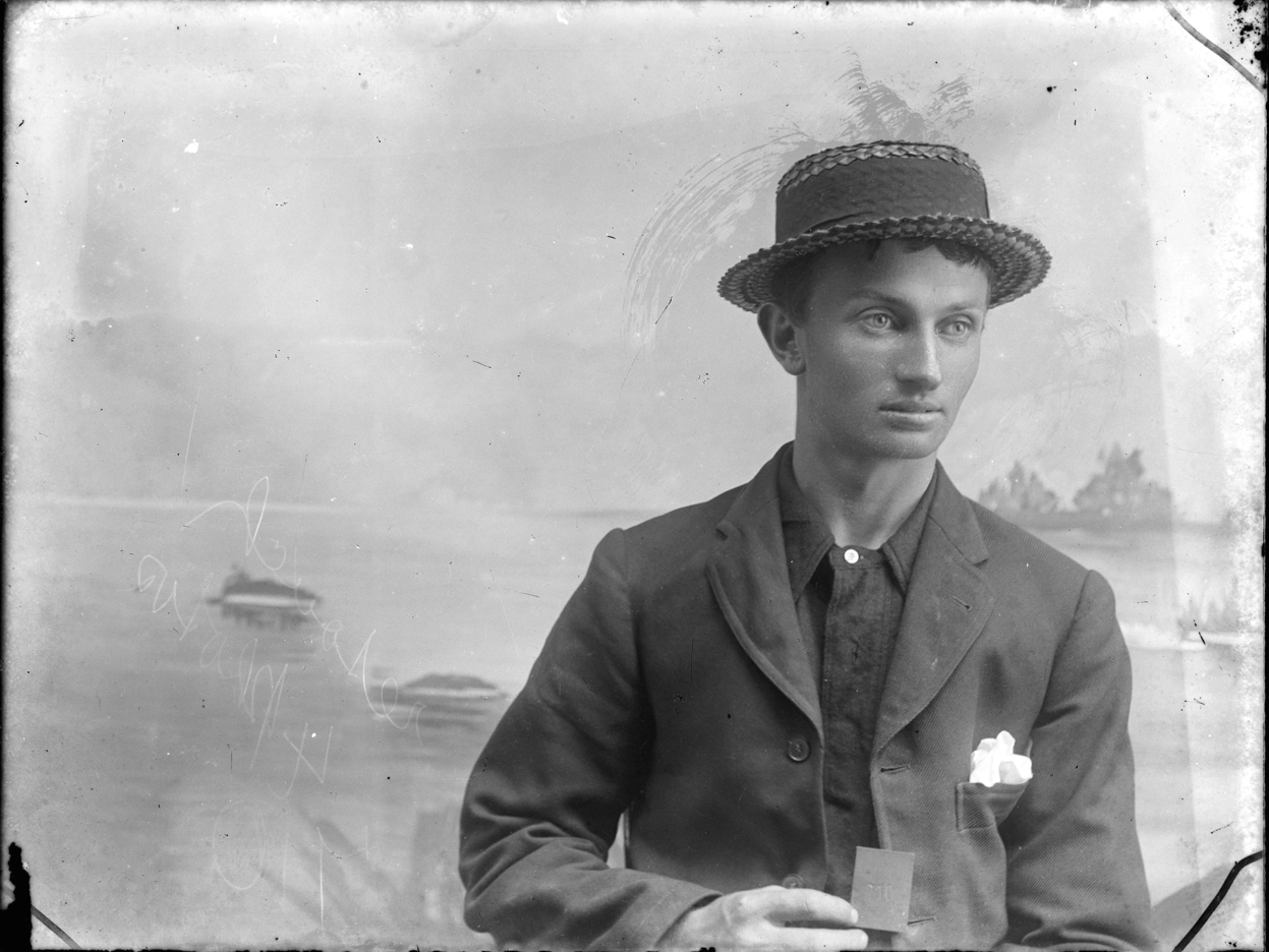 Young man in a straw hat