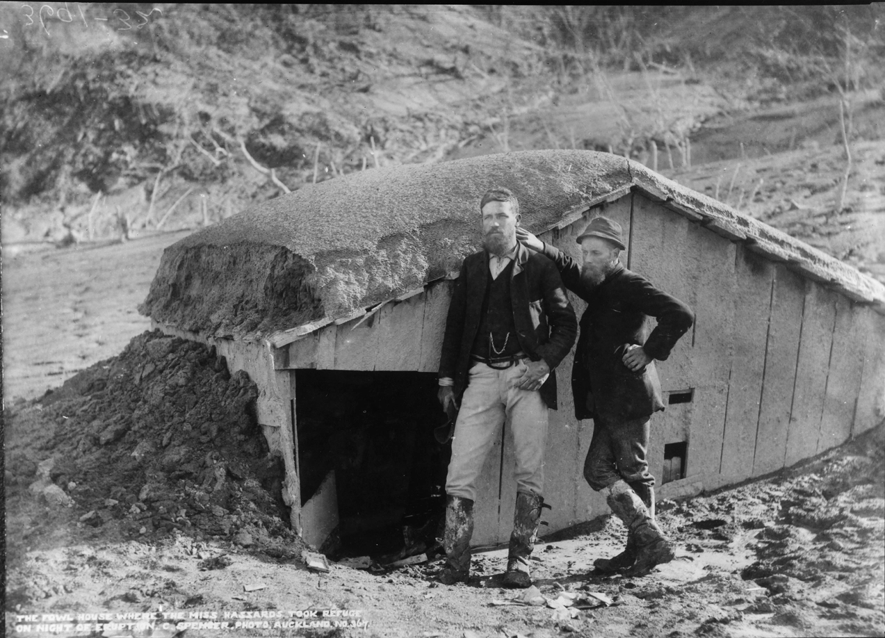 Showing John C Blythe and Harry Lundius standing outside Haszard's fowl house...