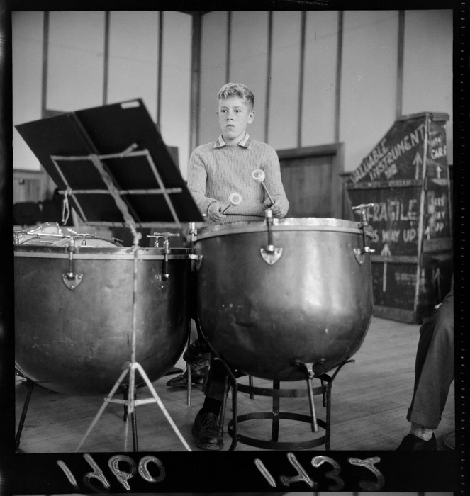 An unidentified boy playing kettle drums, at National Youth Orchestra rehearsal