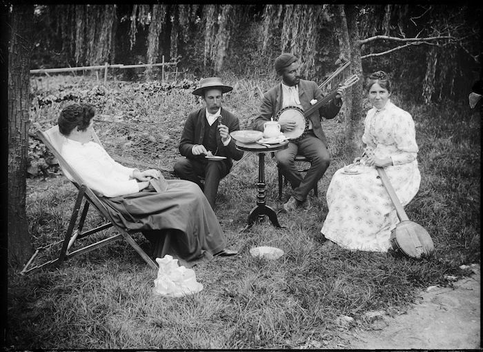 Lydia and William Williams seated in a garden with two others