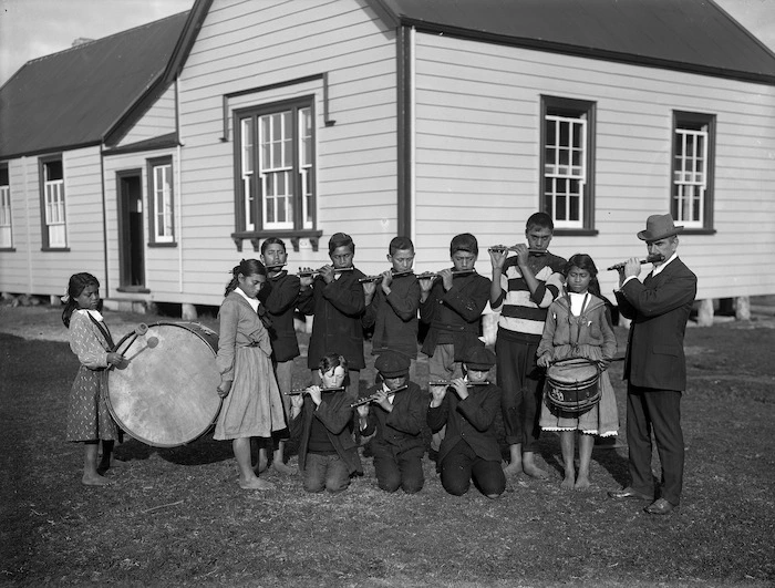 Group of school students from Ahipara School, playing musical instruments