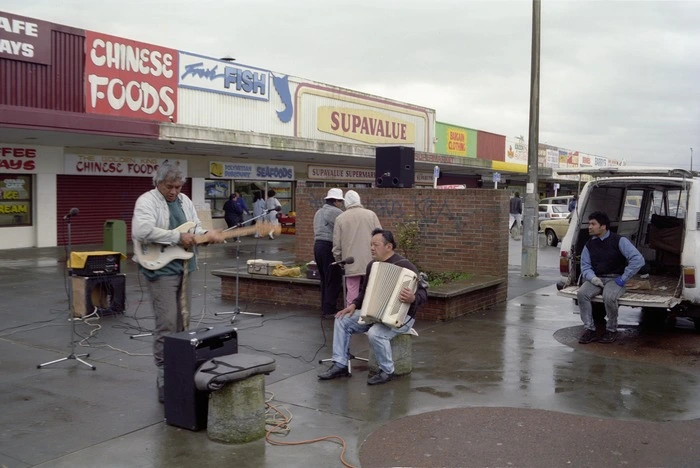 Unidentified band busking at South Auckland strip mall