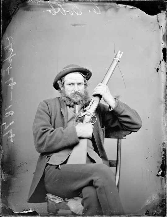 Mr C Cobb, with a rifle