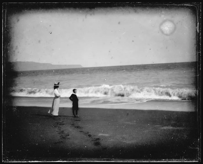 Woman and boy on a beach