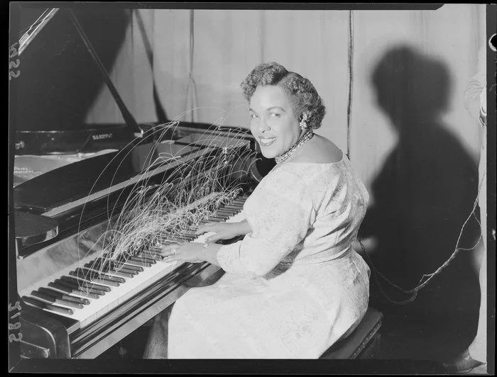 Composite exposure depicting Winifred Atwell playing a piano