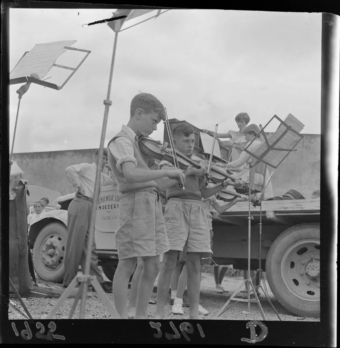 Children playing violin and piano in outdoor concert, Wainuiomata, Lower Hutt