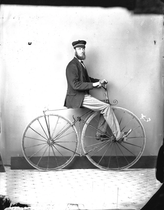 Man riding a Boneshaker bicycle