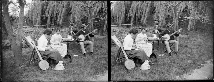 Lydia Myrtle Williams and unidentified group of banjo players in the garden at the Williams' Carlyle Street house, Napier, Hawkes Bay Region, including hammock
