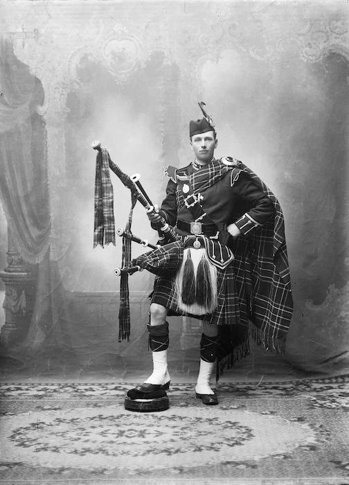 Unidentified Scottish piper, in full national costume