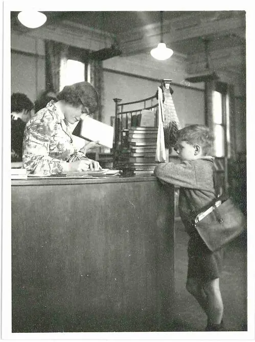 At the issues desk in the Children's Library