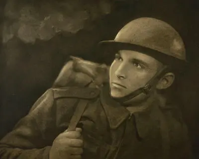 (Soldier in WW1 helmet and gear)