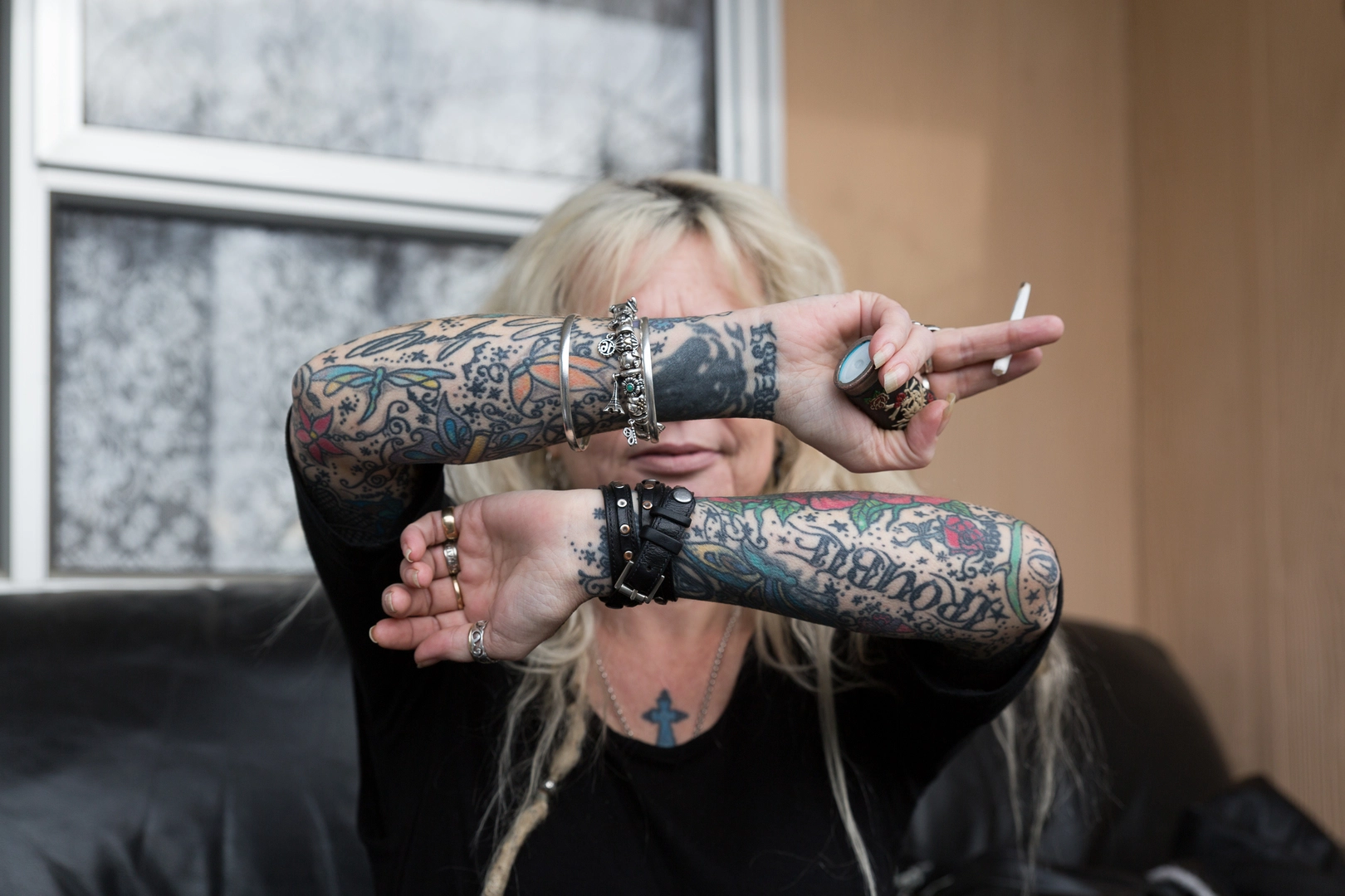 Millie showing her tattoos