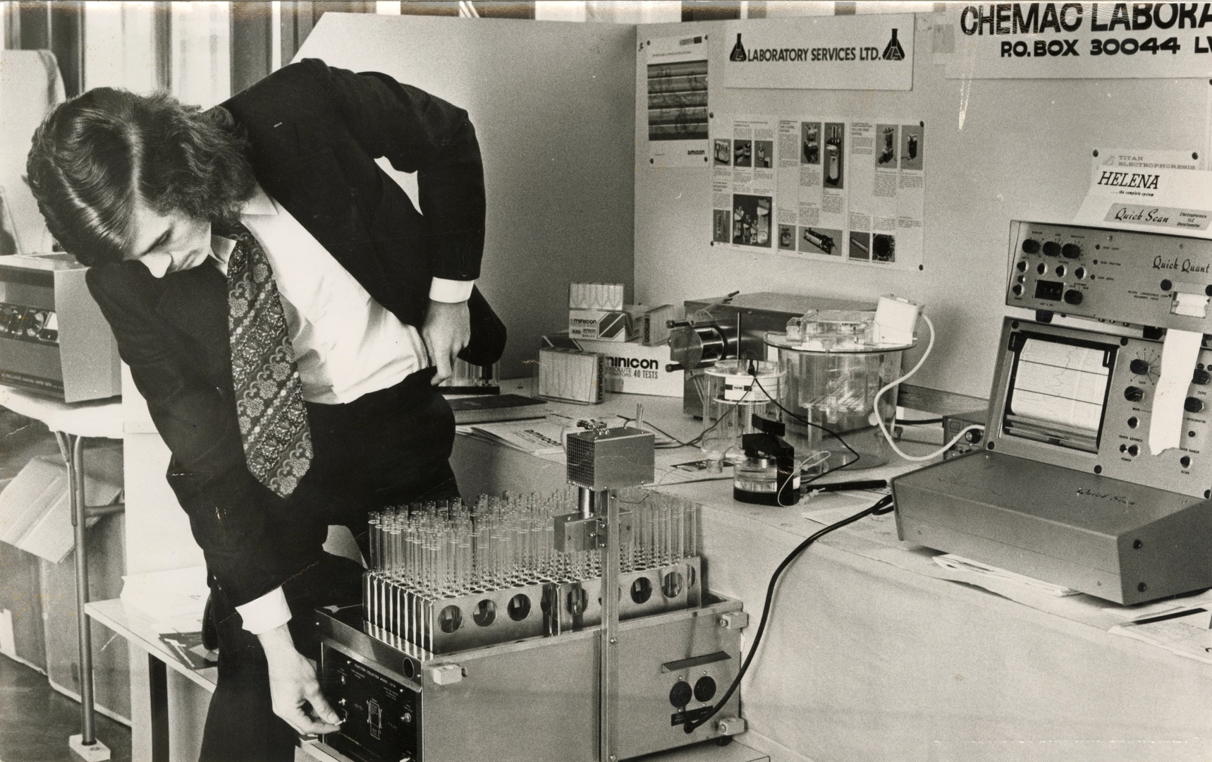 J. Turnbull with a fraction collector