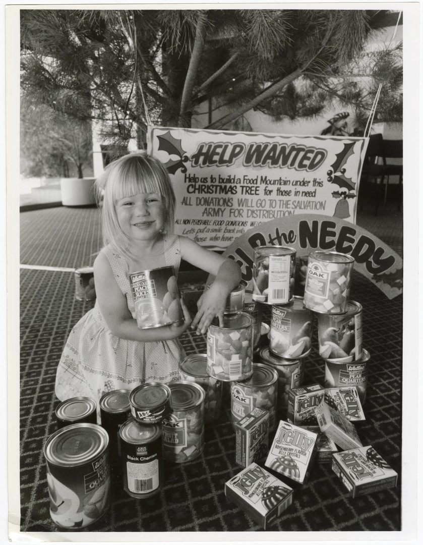 Jayme Harvey with Salvation Army Christmas donations