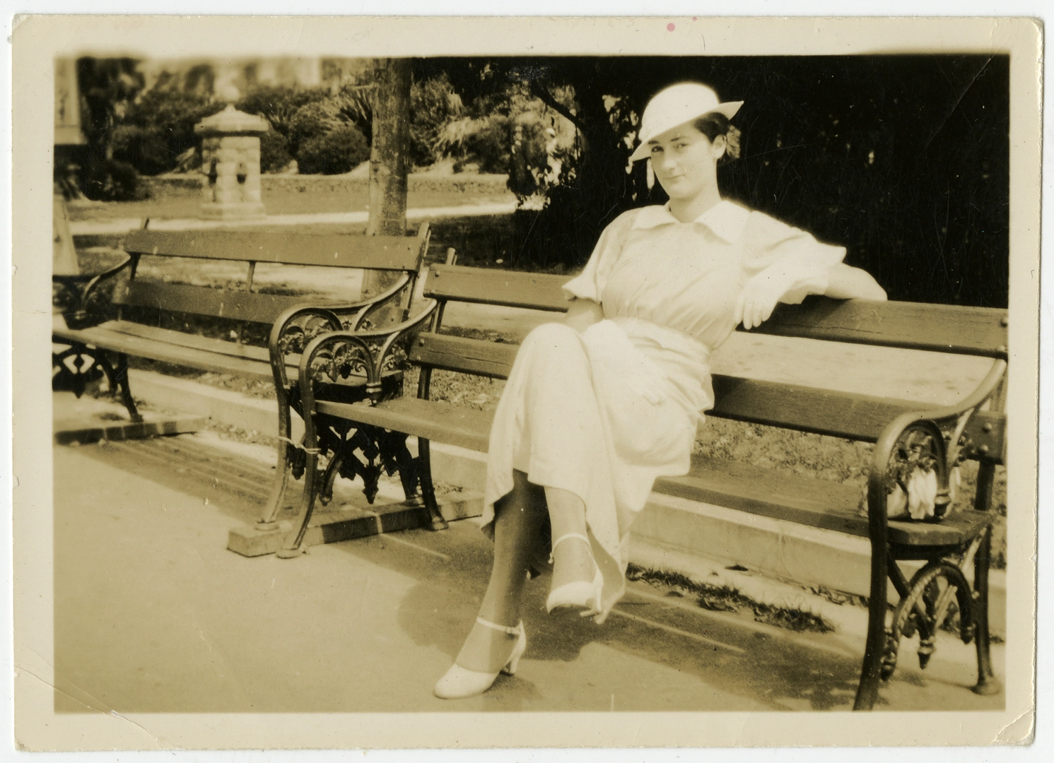 Miss Joyce Macaulay on a park bench