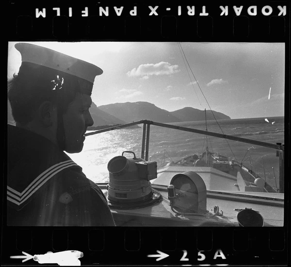 H.M.N.Z.S. Tamure at sea with sailor watching out to sea