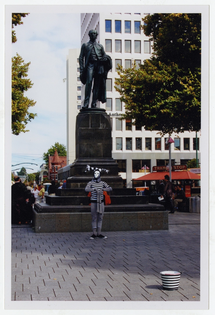 Mime in front of John Robert Godley statue