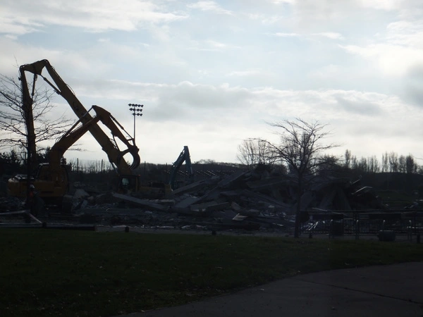 Excavators surrounded by rubble