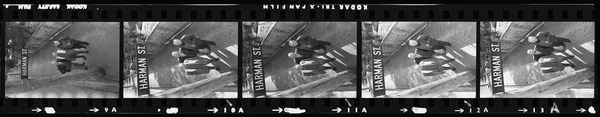 Harman brothers looking at the Harman Street sign