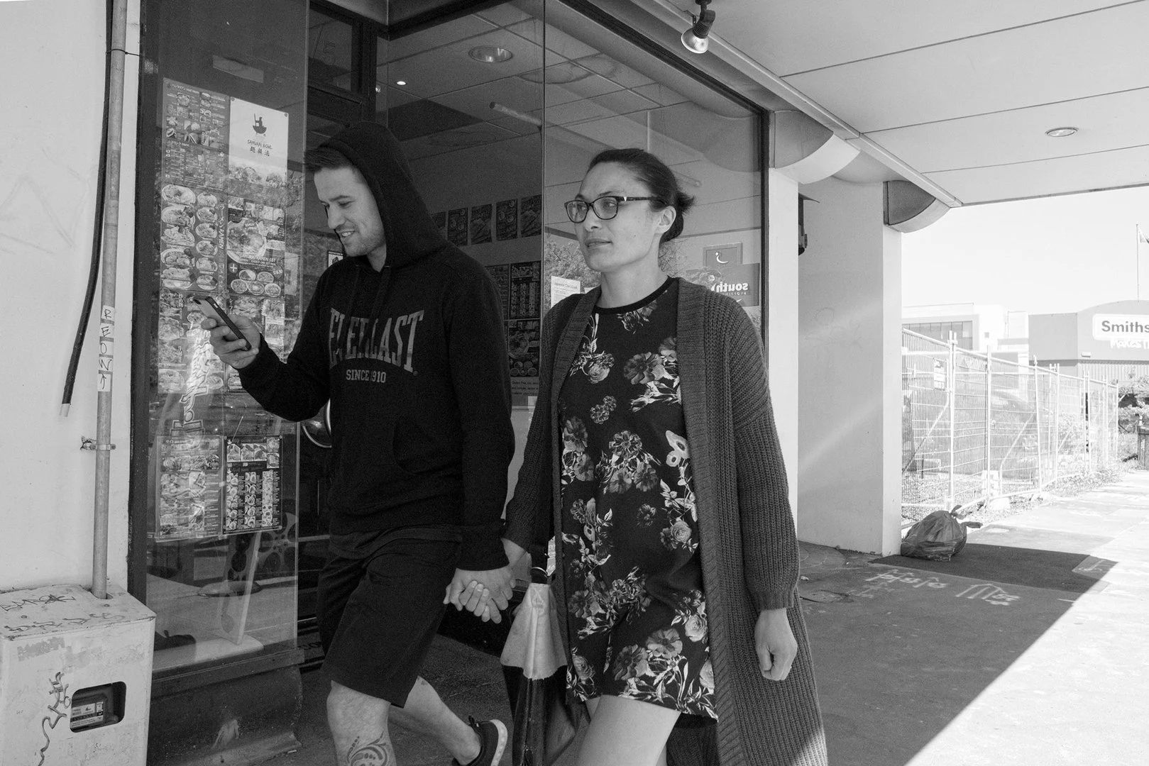 Holding hands outside Samurai Bowl