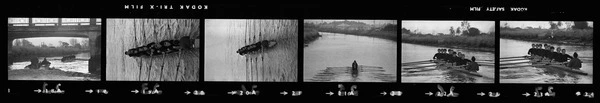 Oarsmen in a coxed eight rowing at Kerrs Reach