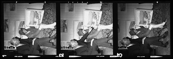 Audrey Durant and unidentified man with paintings