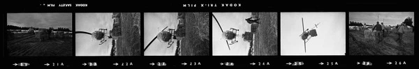 Helicopter lifting hay bales