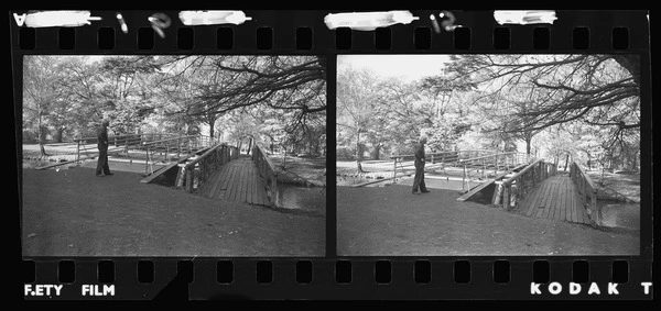 Man standing beside bridges