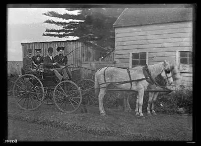 [Messrs. Powell, Mitchell and two women in a horse drawn carriage]