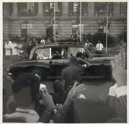 HM Queen Elizabeth II & Prince Charles (Prince Philip & Princess Anne obscured behind them) departing in regal Rolls Royce limousine. Opening of Parliament. March 1970.