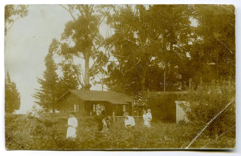 Postcard: Lovell-Smith family group in back garden at Westcote 1912