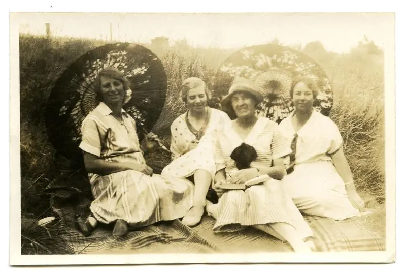 Photograph, Black and White: Doris, Connie, an unknown woman and Kitty Lovell-Smith on a picnic rug