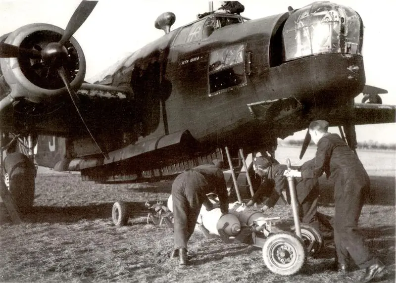 Wellington airplane being loaded with bombs