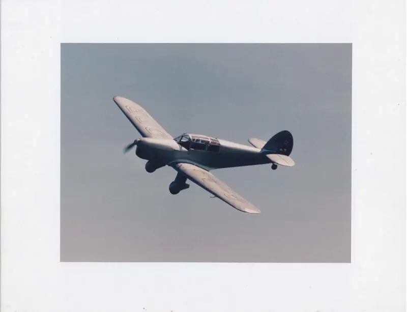 Photograph of Jean Batten's Percival Gull in flight