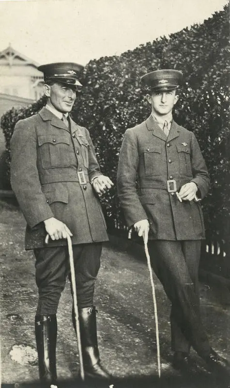 Photograph of Vivian Walsh and Stewart Napier wearing air force uniforms and both with walking sticks