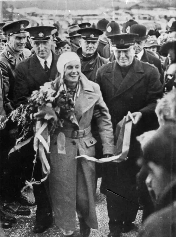 Jean Batten surrounded by officials and supporters at the conclusion of her England - New Zealand flight