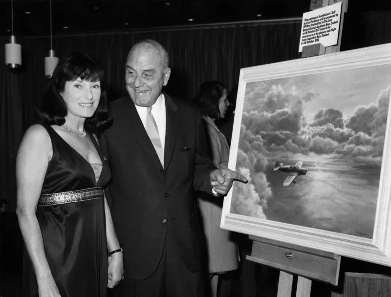 Jean Batten and Edgar Percival in front Cyril Peckham's painting of Percival Gull G-ADPR