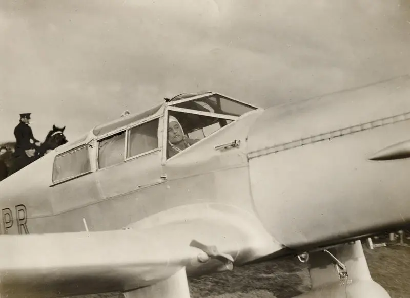 Jean Batten arriving in Mangere, Auckland after solo flight from England in Percival Gull G-ADPR aircraft