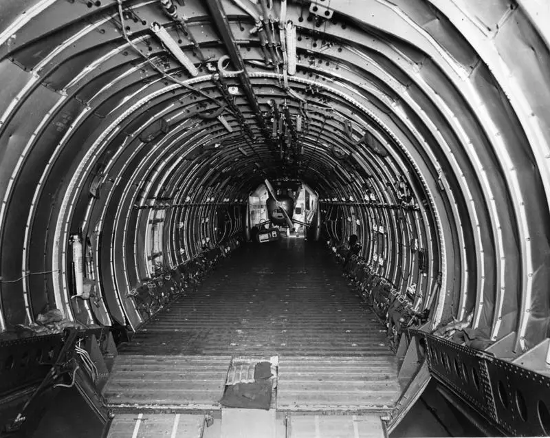 Cargo compartment of Boeing C-97 Stratofreighter with a Boeing scout loaded into the forward part of the cargo hold