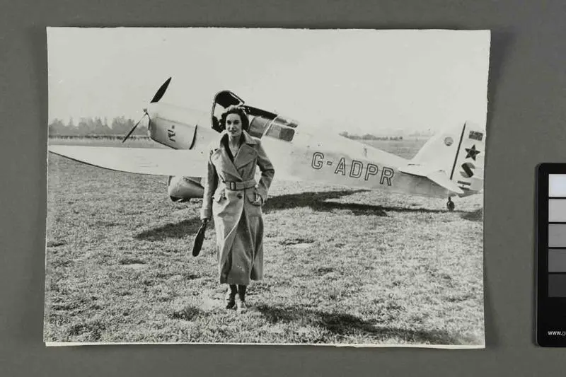 Jean Batten in front of Percival Gull G-ADPR at Hatfield Aerodrome, England