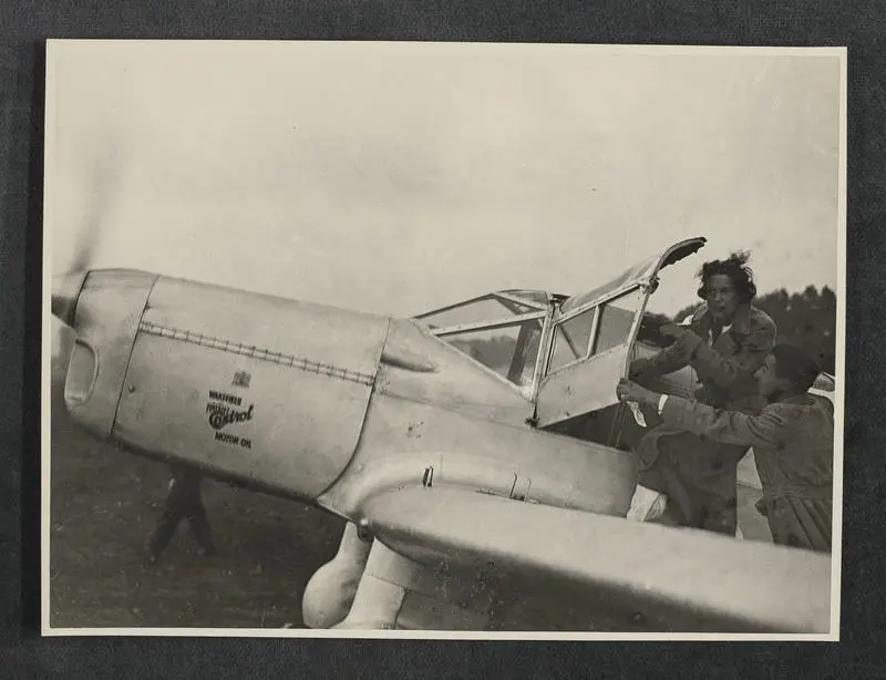 Jean Batten at the cockpit door of G-ADPR after the Australia-England return flight was diverted to Naples