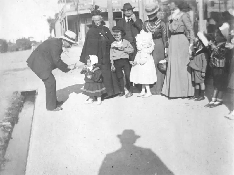 Street scene with members of the Chegwidden and Knapp families