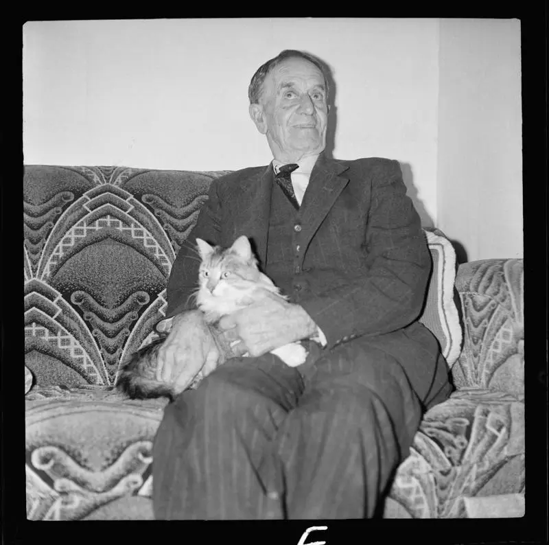 Unknown, man with cat