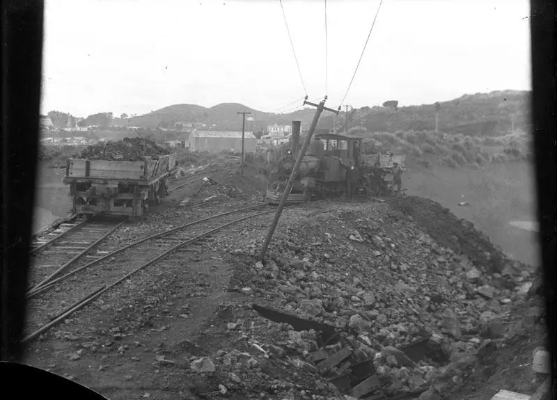 "Reclamation of area between Mikotahi and Paritutu using material carted by train. View from Mikotahi looking East.