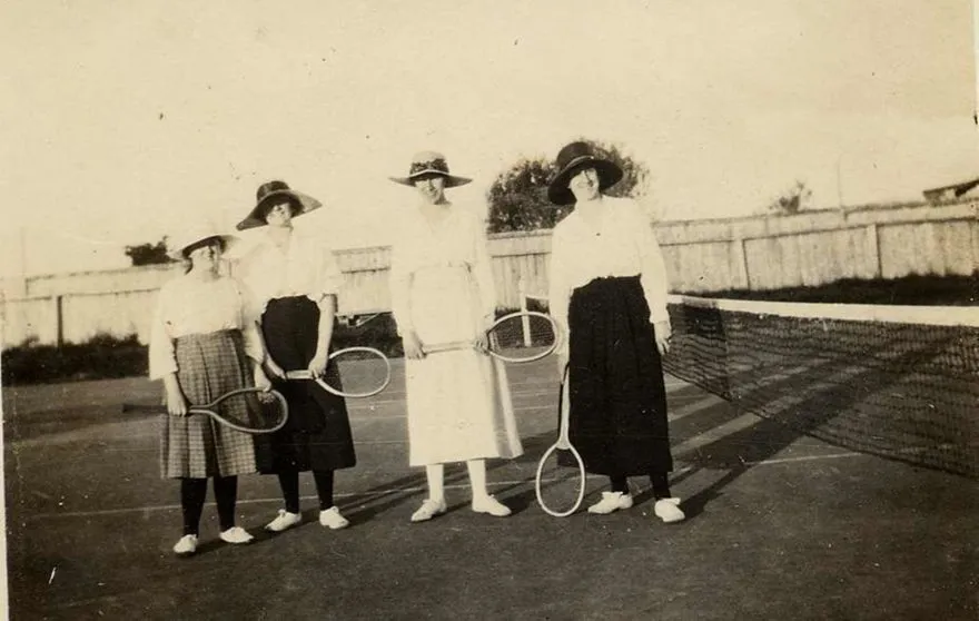 Four Young Women on Tennis Court