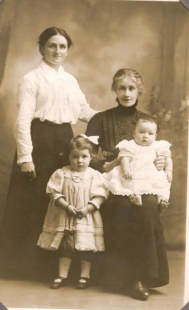 Three generations - Group sitting of Mother, Daughter and Grandchildren. c1914-1918.
