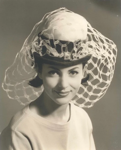 Hat with a wide mesh veil