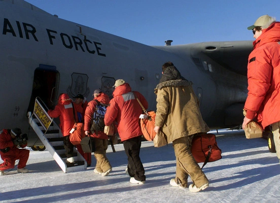 Winter Over personnel board a C-141C Starlifter at McMurdo Station in Antarctica to return to Christchurch, New Zealand, during Operation DEEP FREEZE 2001