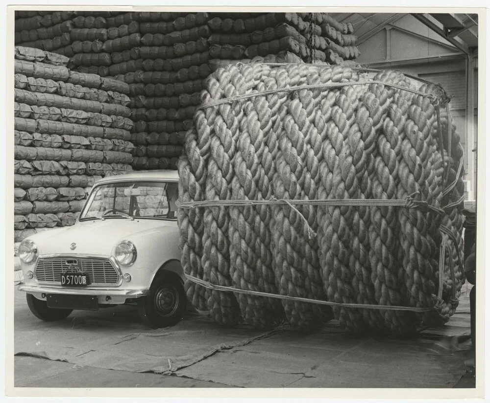 Large roll of rope next to Mini car